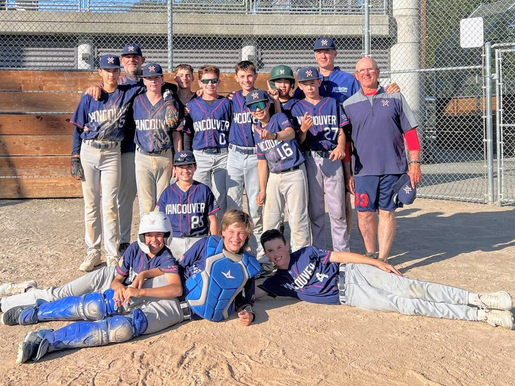 13U AAA Expos raising the Summer Slam Premier Sports Tournament trophy in Everett.